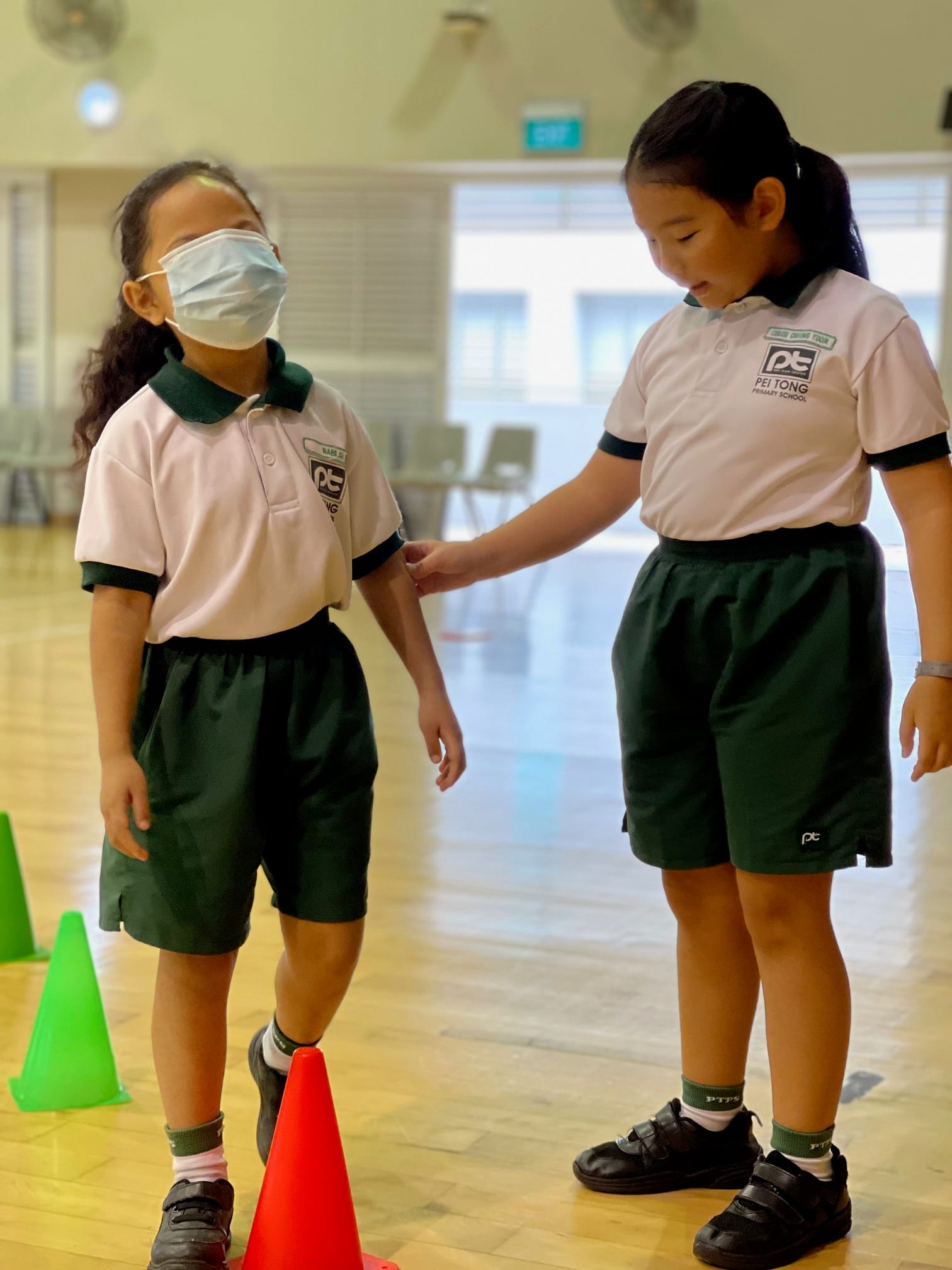 A student guides her blindfolded partner through an inclusive sports activity, encouraging teamwork, trust, and empathy during the I’m Possible Paralympic Education Programme.